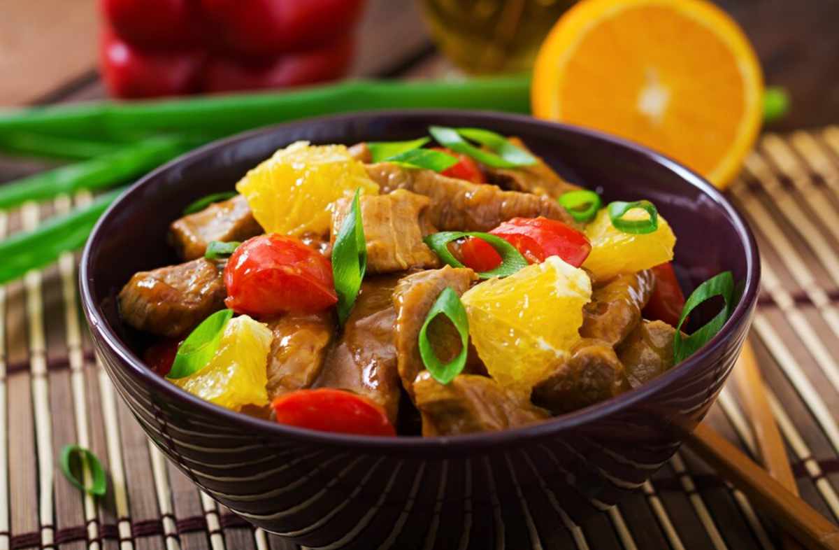 Authentic Guyanese food dishes including Cook-Up Rice, Pepperpot, Alu Paratha, Black Cake, and Pine Tart, showcasing the rich flavors of Guyanese cuisine.