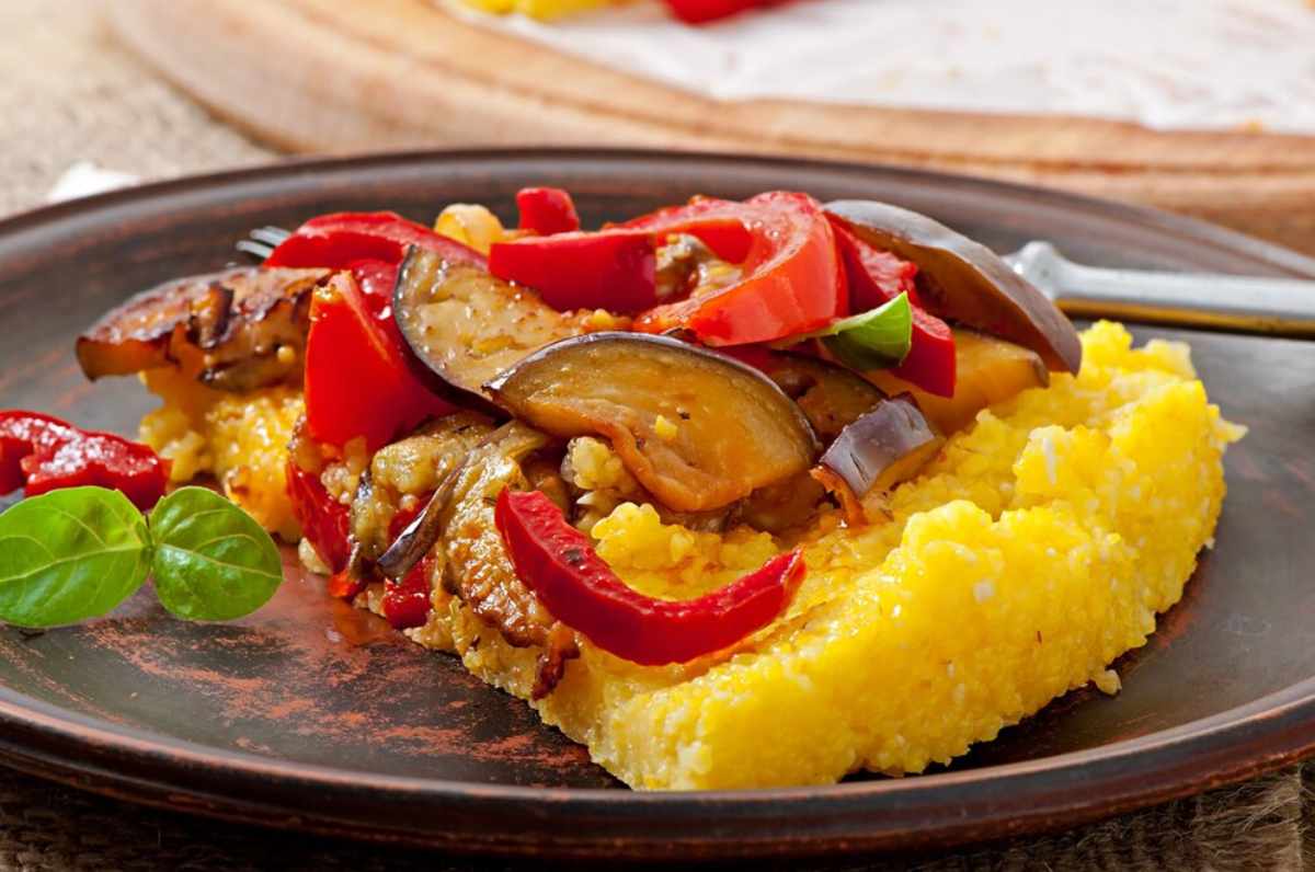 Authentic Guyanese dishes, such as Cook-Up Rice, Pepperpot, Alu Paratha, and Black Cake, representing the vibrant and flavorful cuisine of Guyana.