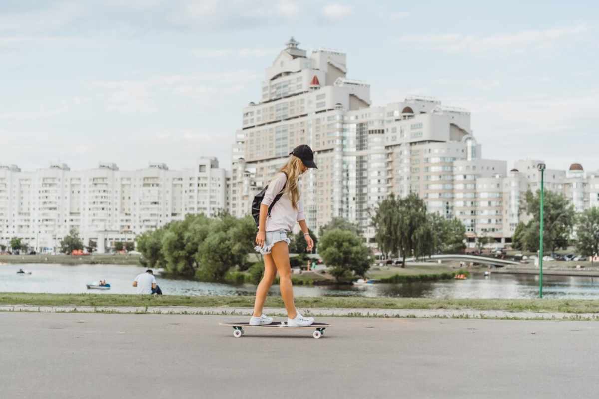 A bustling city street with people walking and modern skyscrapers in the background, representing the fast-paced lifestyle of city dwellers.