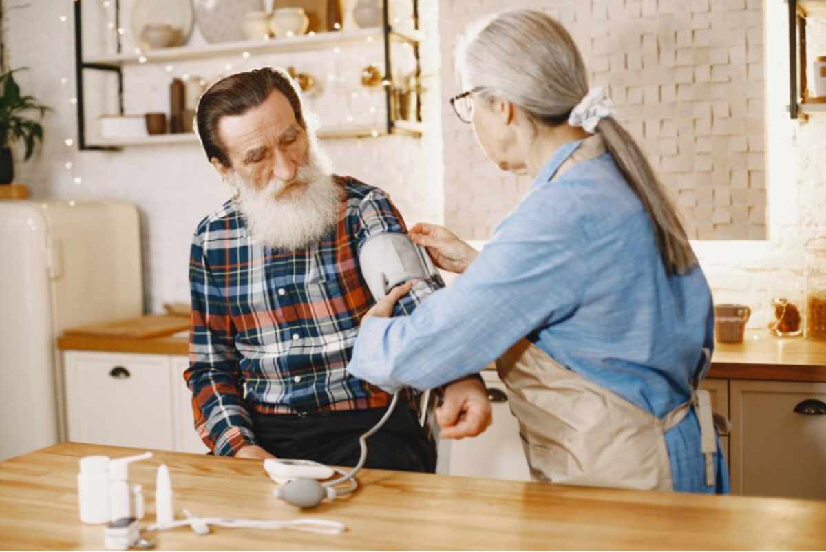 An elderly person reviewing financial options and documents to understand how to pay for nursing home care with Social Security benefits, while considering other financial assistance options.