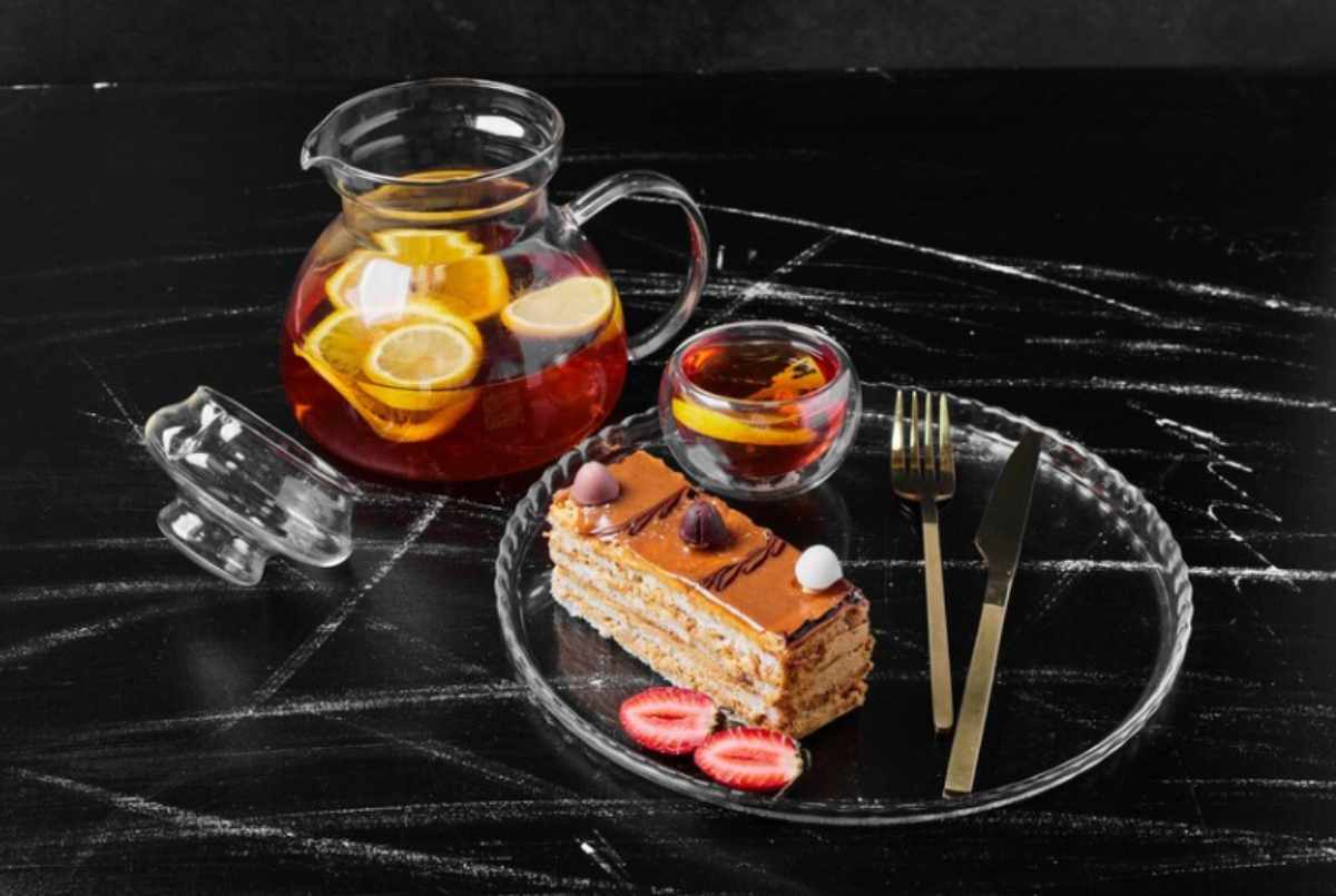 A Whisky Cake Old Fashioned cocktail served in a glass, garnished with orange peel, offering a rich blend of whisky, sweetness, and dessert-like flavors.