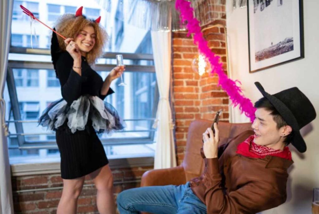 A group of wizards in costumes celebrating at a Trick or Treat Halloween event.