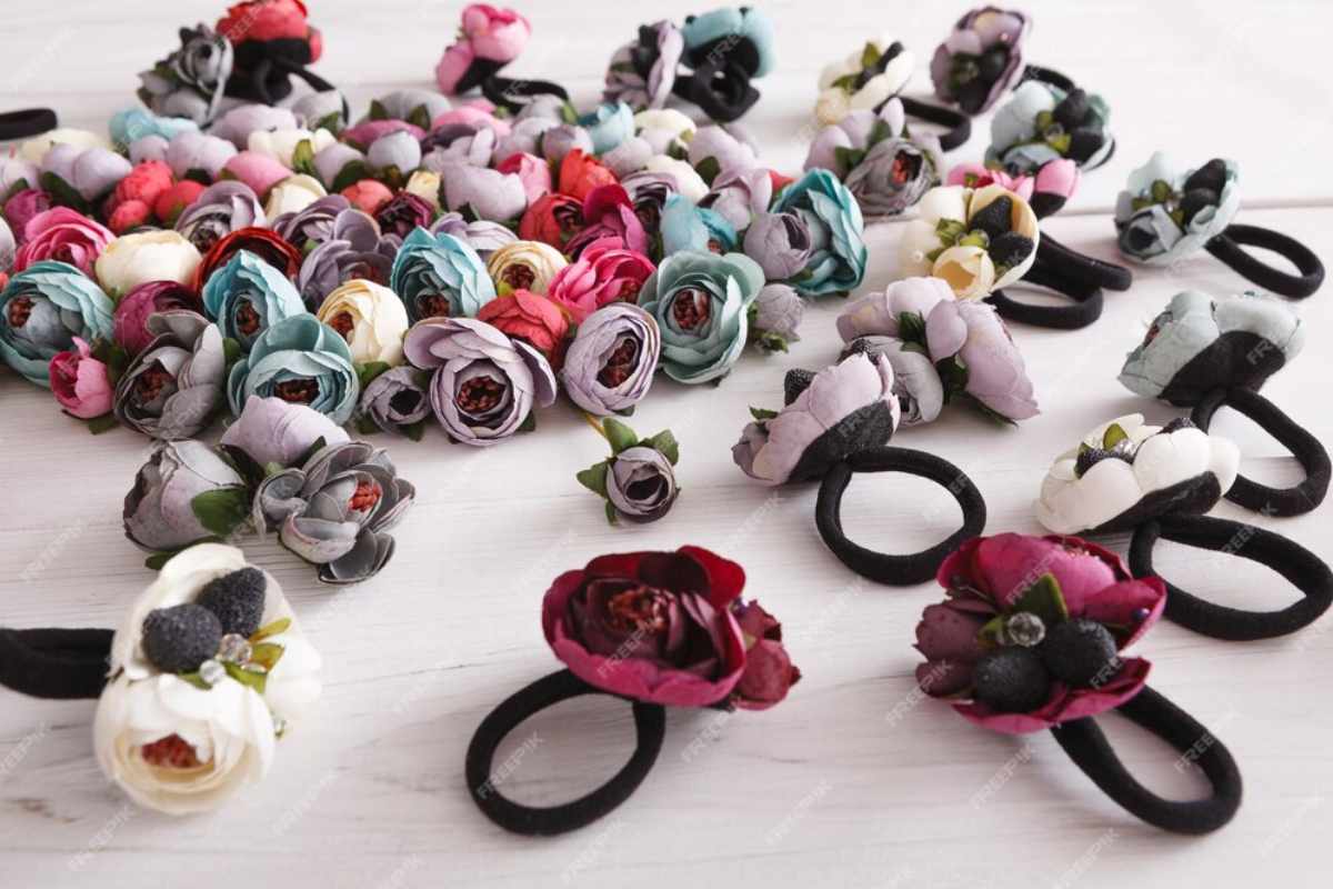 Assorted floral hair accessories including headbands, pins, and clips, styled in different hairdos for weddings, casual outings, and elegant events.