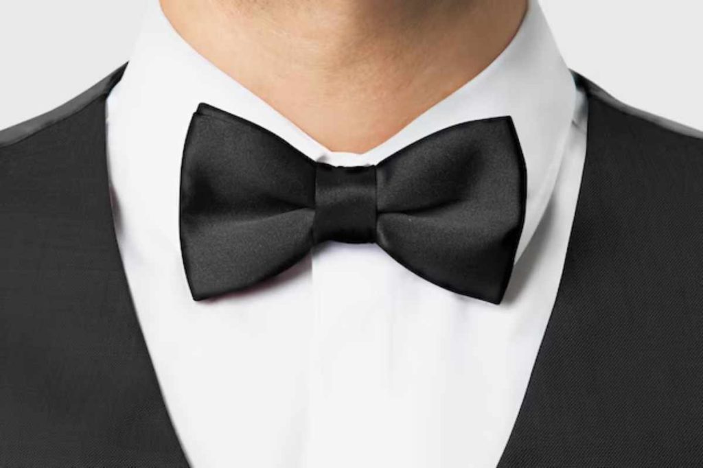 Close-up of a Butterfly Tie with a neat, symmetrical knot, worn with a formal shirt and suit for an elegant and sophisticated look.