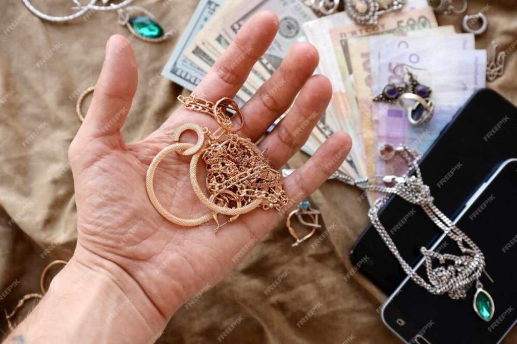 A close-up of copper jewelry being cleaned with a soft cloth and natural cleaning solutions to restore its shine and remove tarnish.