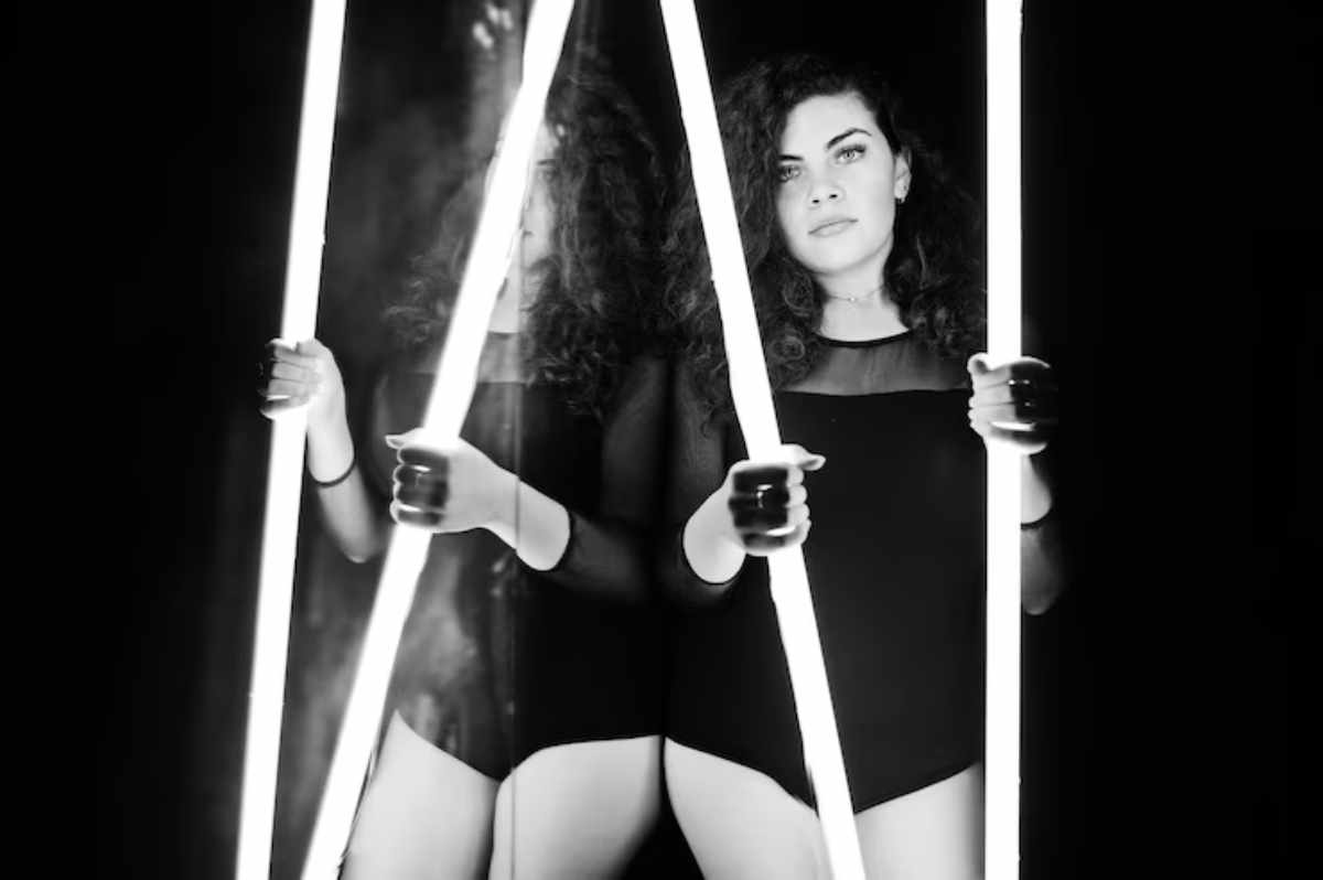 "Close-up of a model wearing a leather harness in an artistic fashion shoot"