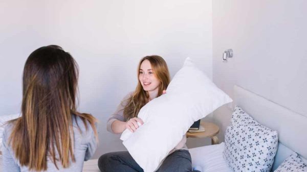 Soft memory foam pillow on a bed, ideal for safe and comfortable self-pleasure.