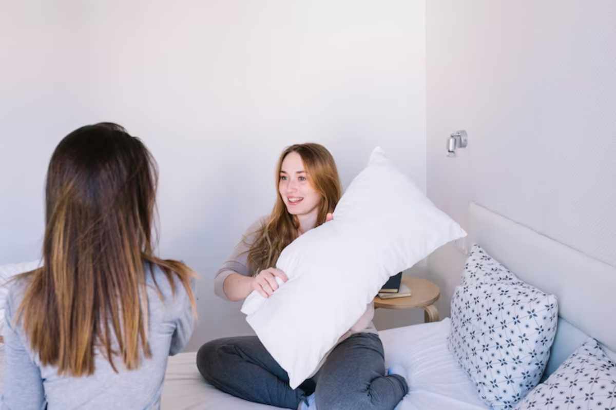 Soft memory foam pillow on a bed, ideal for safe and comfortable self-pleasure.