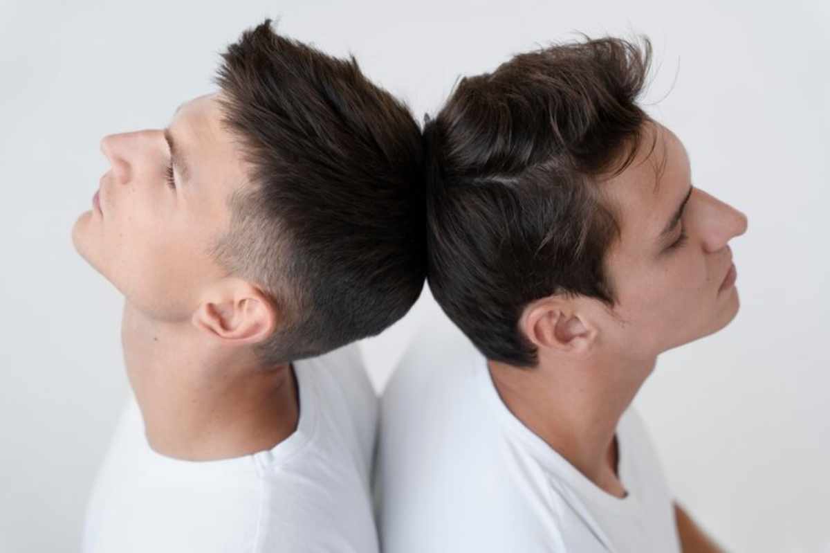 A person wearing ear piercings, debunking the 'gay ear' myth.