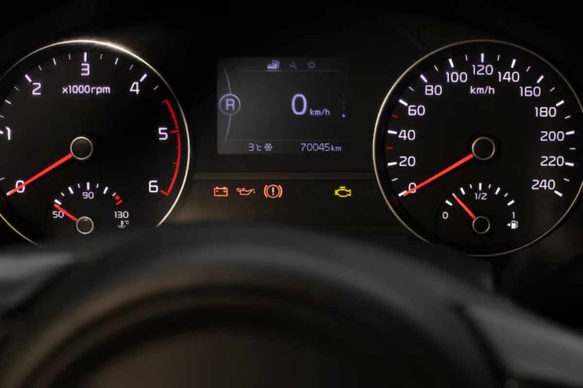 "Dashboard showing a flashing check engine light"