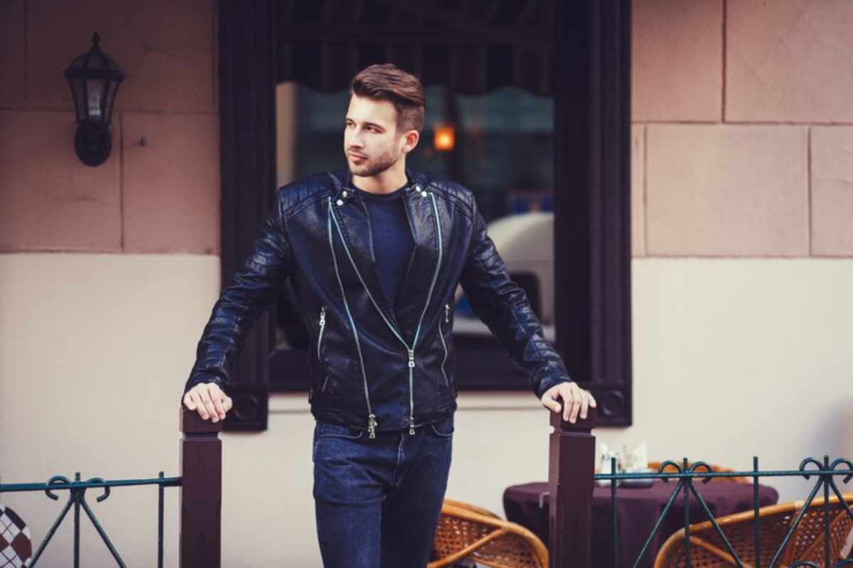 Man in tailored suit walking confidently down the street